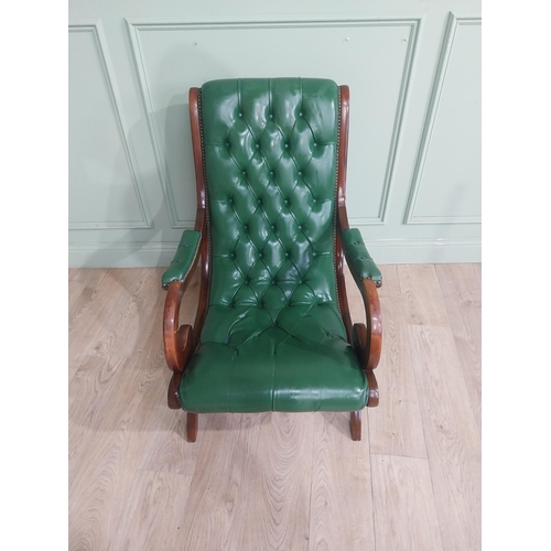 66 - 1950�s mahogany and leather upholstered armchair on lyre supports. {90 cm H x 63 cm W x 90 cm DD}.