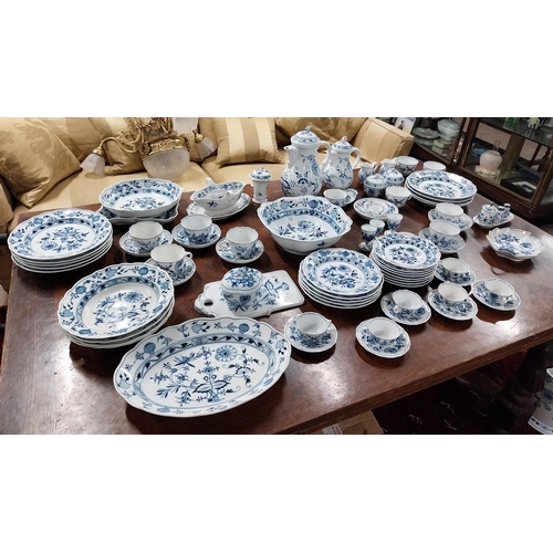 678 - Eighty piece 20th C. Meissen blue and white Onion Pattern dinner and tea set. Underglazed with blue ... 