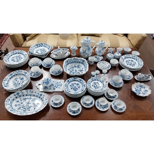 678 - Eighty piece 20th C. Meissen blue and white Onion Pattern dinner and tea set. Underglazed with blue ... 