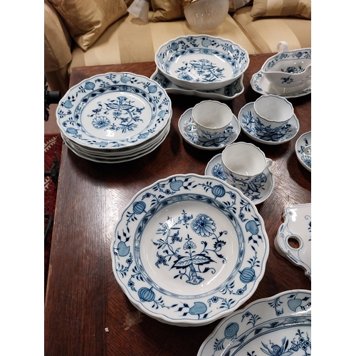 678 - Eighty piece 20th C. Meissen blue and white Onion Pattern dinner and tea set. Underglazed with blue ... 