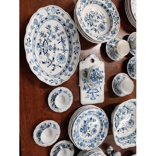 678 - Eighty piece 20th C. Meissen blue and white Onion Pattern dinner and tea set. Underglazed with blue ... 