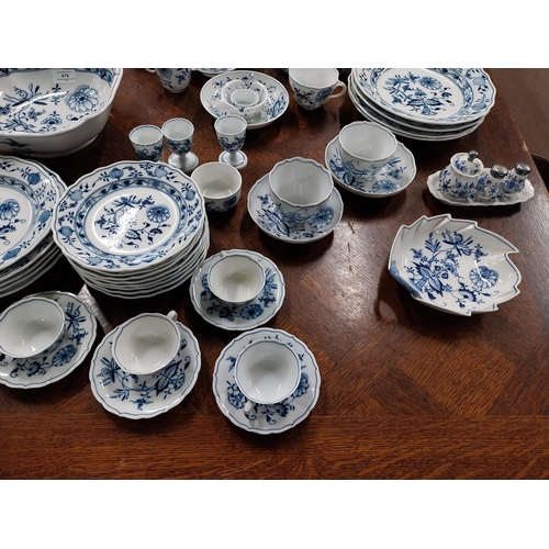 678 - Eighty piece 20th C. Meissen blue and white Onion Pattern dinner and tea set. Underglazed with blue ... 