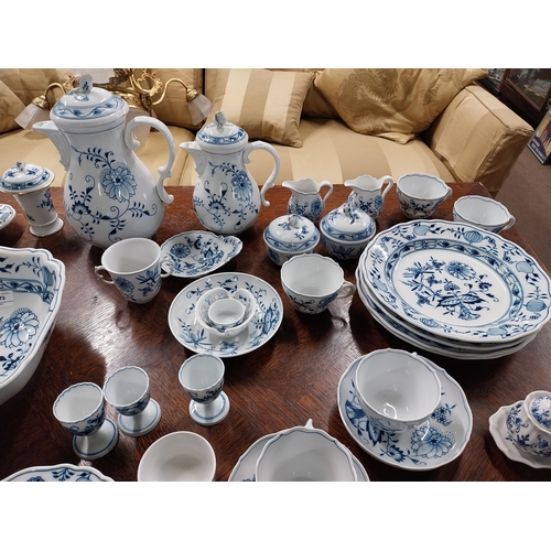 678 - Eighty piece 20th C. Meissen blue and white Onion Pattern dinner and tea set. Underglazed with blue ... 