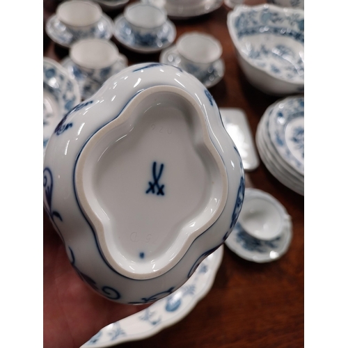 678 - Eighty piece 20th C. Meissen blue and white Onion Pattern dinner and tea set. Underglazed with blue ... 