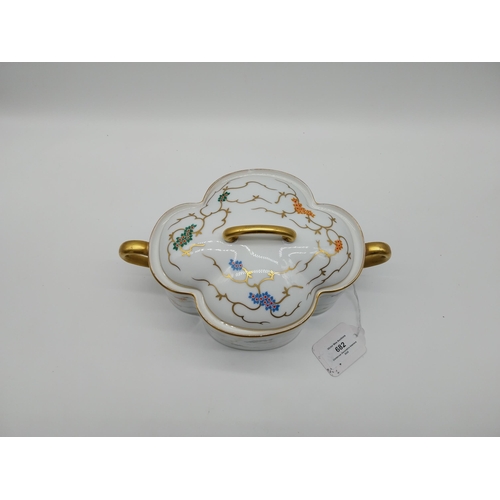 682 - Ceramic lidded tureen gilded and decorated with flowers. { 14.5 cm H x 20 cm W}.