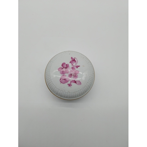 687 - Pink and white ceramic lidded dish decorated with flowers {6 cm H x 10 cm Dia.} and ceramic pin cush... 