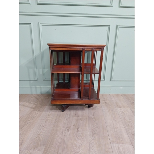 69 - Edwardian mahogany revolving bookcase. {83 cm H x 58 cm W x 58 cm W}.