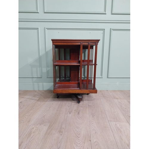 69 - Edwardian mahogany revolving bookcase. {83 cm H x 58 cm W x 58 cm W}.