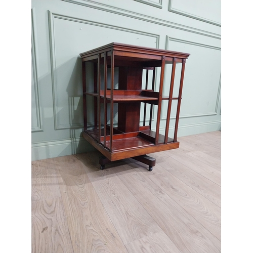 69 - Edwardian mahogany revolving bookcase. {83 cm H x 58 cm W x 58 cm W}.