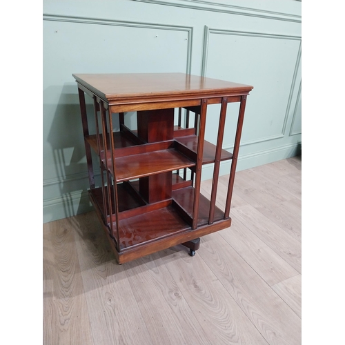 69 - Edwardian mahogany revolving bookcase. {83 cm H x 58 cm W x 58 cm W}.