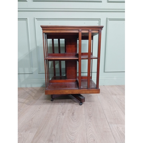 69 - Edwardian mahogany revolving bookcase. {83 cm H x 58 cm W x 58 cm W}.