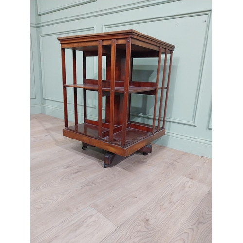 69 - Edwardian mahogany revolving bookcase. {83 cm H x 58 cm W x 58 cm W}.