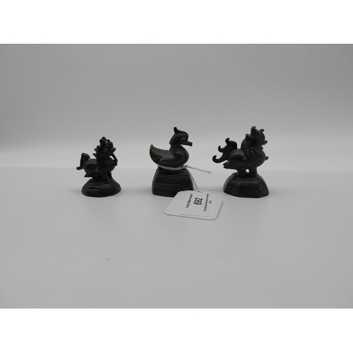 692 - Three 19th C. bronze netsukes � two Dogs of Fu and Duck. {5.5 cm H to 4.5 cm H}.