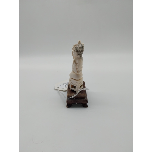 693 - Late 19th C. Chinese carved bone figure on wooden base. {10 cm H}.