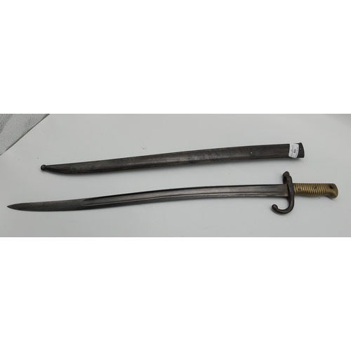 700 - WWI rifle bayonet and scabbard. {71 cm L}.