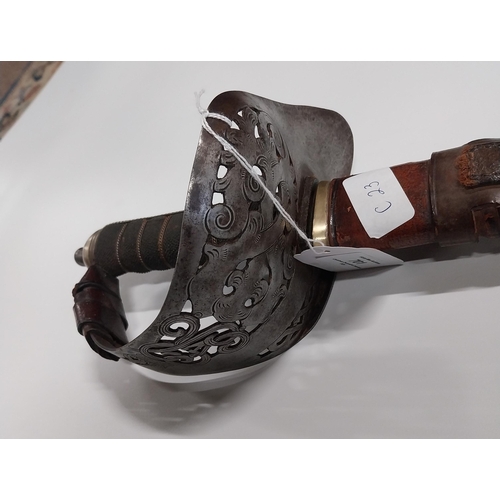 701 - George V Officer�s sword with basket hilt and leather scabbard. {104 cm L}.