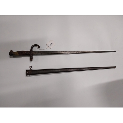 708 - WWI Bayonet with scabbard. {66 cm L}.