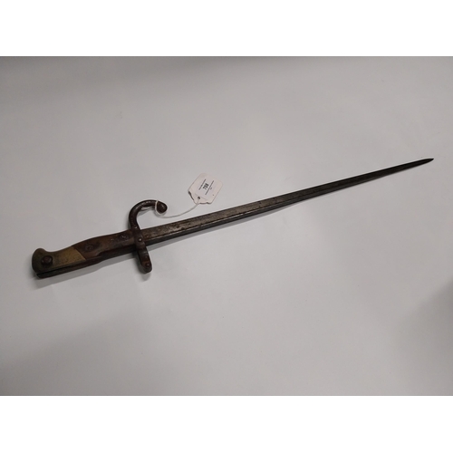 708 - WWI Bayonet with scabbard. {66 cm L}.