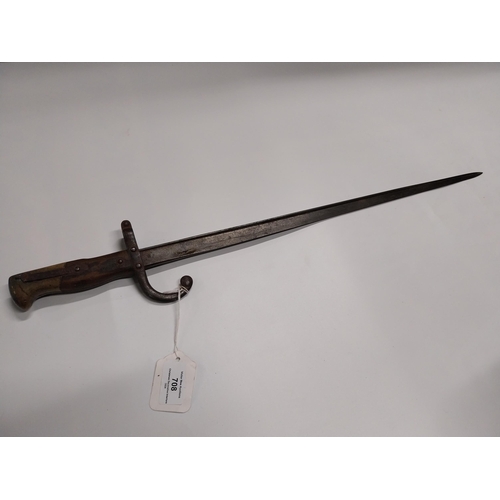 708 - WWI Bayonet with scabbard. {66 cm L}.