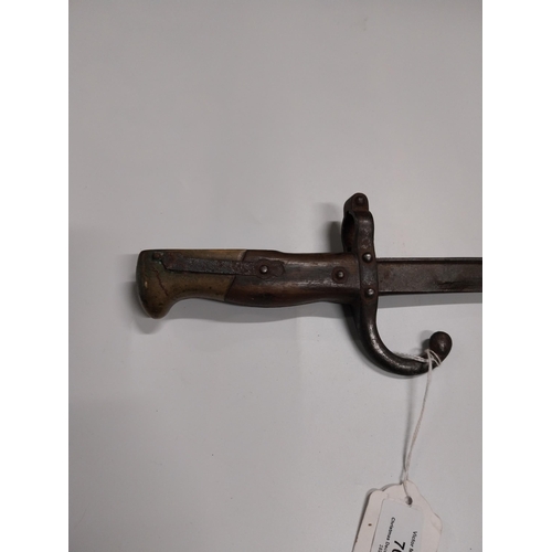 708 - WWI Bayonet with scabbard. {66 cm L}.