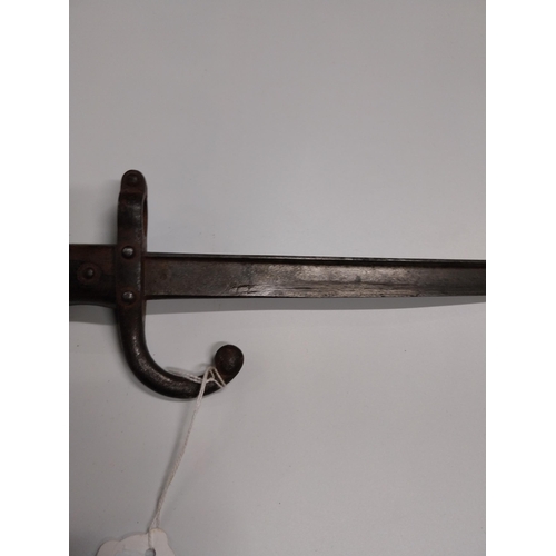 708 - WWI Bayonet with scabbard. {66 cm L}.