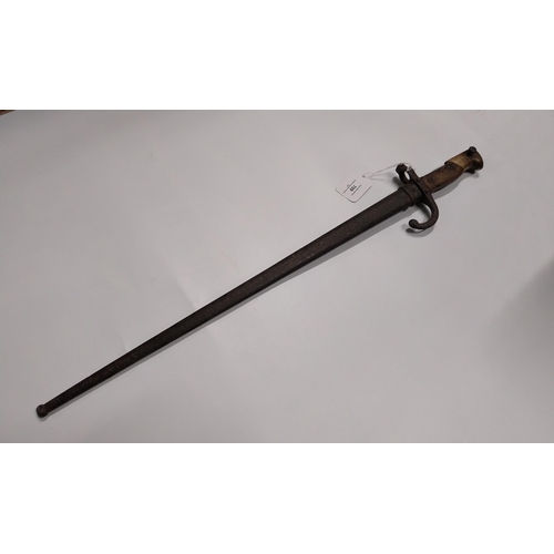 709 - WWI Bayonet with scabbard. {66 cm L}.