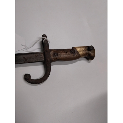 709 - WWI Bayonet with scabbard. {66 cm L}.