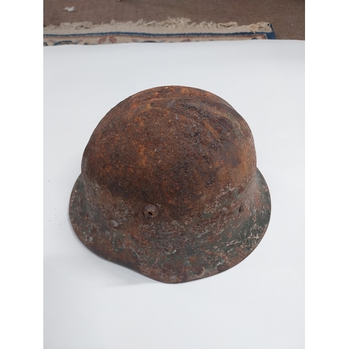 726 - WWII German helmet {18cm H x 22cm W x 32cm D}