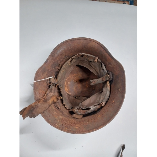 726 - WWII German helmet {18cm H x 22cm W x 32cm D}