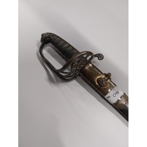 730 - V R Officer�s sword with floral decoration on blade with basket hilt in scabbard.