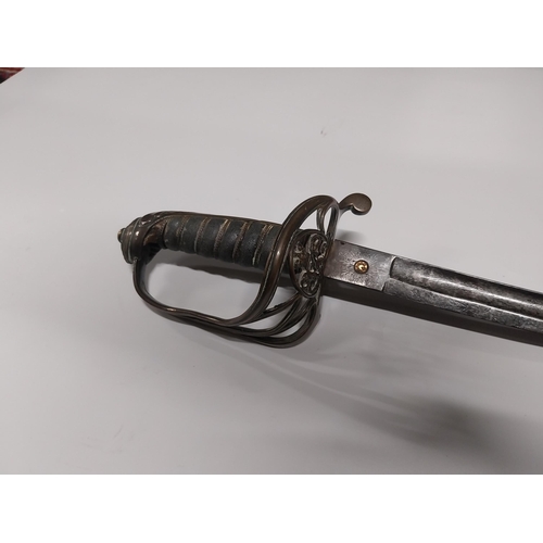 730 - V R Officer�s sword with floral decoration on blade with basket hilt in scabbard.