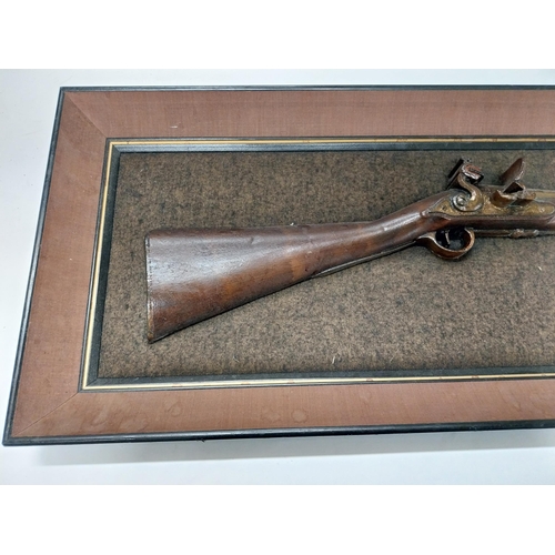 730A - Model of 1777 Flintlock Blunderbuss mounted on wooden frame. {38 cm H x 92 cm W}.