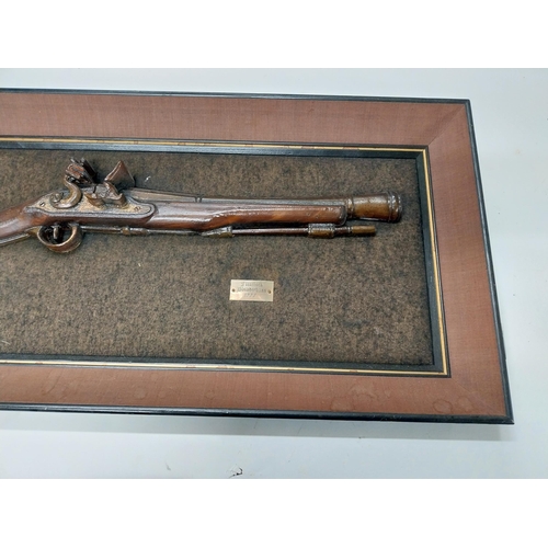 730A - Model of 1777 Flintlock Blunderbuss mounted on wooden frame. {38 cm H x 92 cm W}.