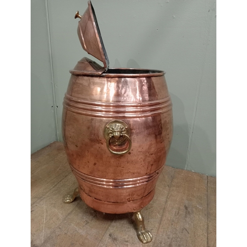 74 - Brass and copper flour bin with copper scoop on three outswept paw feet.  {H 70cm x Dia 50cm}. NOT A... 