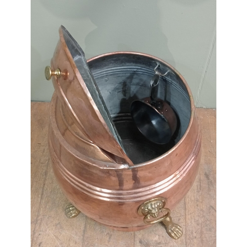 74 - Brass and copper flour bin with copper scoop on three outswept paw feet.  {H 70cm x Dia 50cm}. NOT A... 