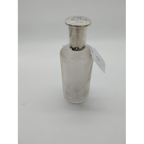 757 - Threaded clear glass Eau de Toilette bottle with English silver top and original cork stopper. Hallm... 