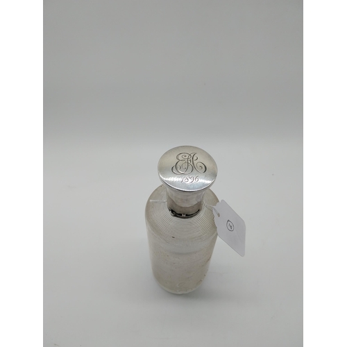 757 - Threaded clear glass Eau de Toilette bottle with English silver top and original cork stopper. Hallm... 