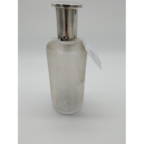 757 - Threaded clear glass Eau de Toilette bottle with English silver top and original cork stopper. Hallm... 