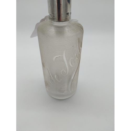 757 - Threaded clear glass Eau de Toilette bottle with English silver top and original cork stopper. Hallm... 