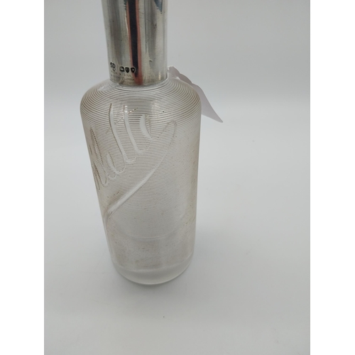 757 - Threaded clear glass Eau de Toilette bottle with English silver top and original cork stopper. Hallm... 