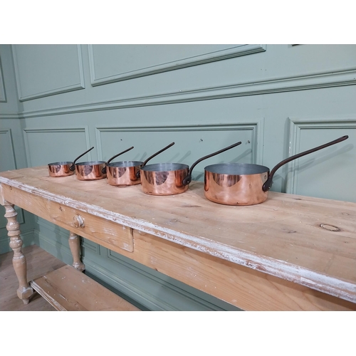 8 - Set of five graduated French copper and wrought iron saucepans. {19 cm H x 40 cm W  x 20 cm D} to {1... 