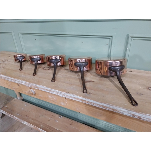 8 - Set of five graduated French copper and wrought iron saucepans. {19 cm H x 40 cm W  x 20 cm D} to {1... 