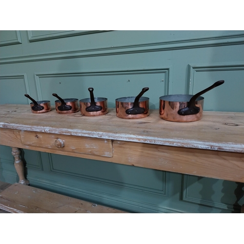 8 - Set of five graduated French copper and wrought iron saucepans. {19 cm H x 40 cm W  x 20 cm D} to {1... 