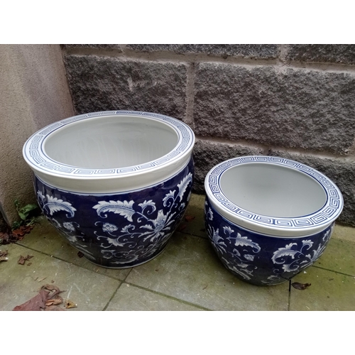 821 - Pair of blue and white oriental garden pots {H 33cm x Dia 40cm and H 24cm x Dia 30cm}. NOT AVAILABLE... 