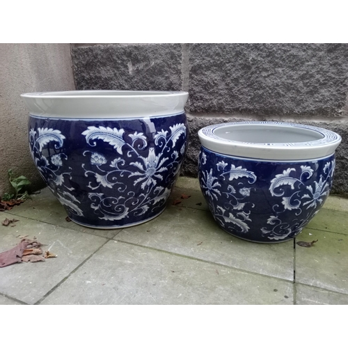 821 - Pair of blue and white oriental garden pots {H 33cm x Dia 40cm and H 24cm x Dia 30cm}. NOT AVAILABLE... 