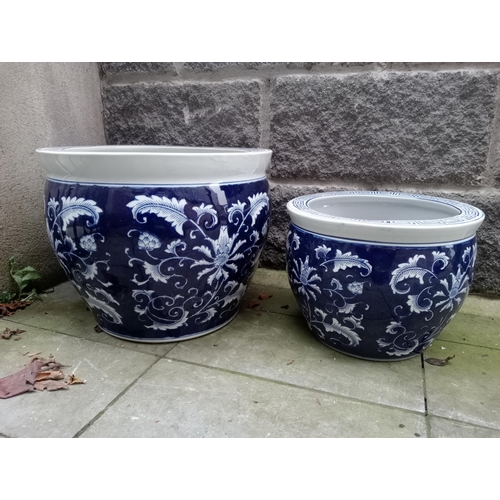 821 - Pair of blue and white oriental garden pots {H 33cm x Dia 40cm and H 24cm x Dia 30cm}. NOT AVAILABLE... 