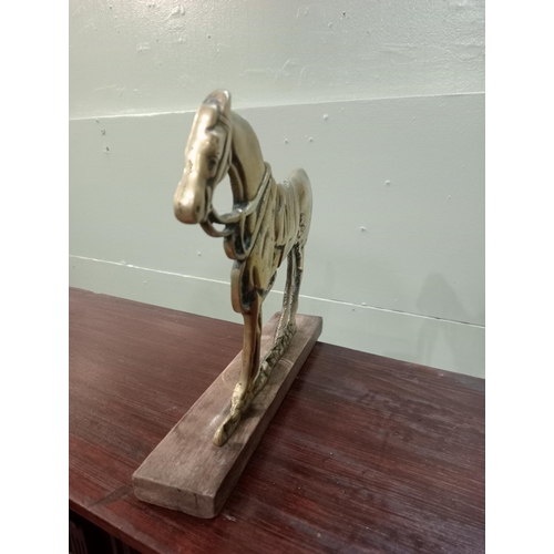 827 - Brass doorstop in the form of a horse. {H 20cm x W 23cm x D 4cm}.  NOT AVAILABLE TO VIEW IN PERSON