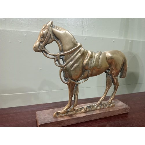 827 - Brass doorstop in the form of a horse. {H 20cm x W 23cm x D 4cm}.  NOT AVAILABLE TO VIEW IN PERSON