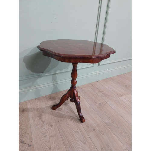 84 - Mahogany and satinwood wine table on turned column on tripod base. {60 cm H x 55 cm Dia.}.