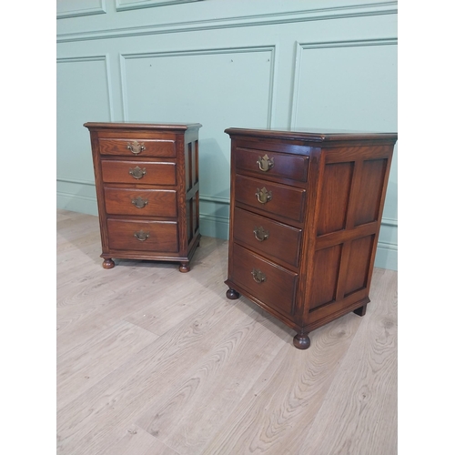 91 - Pair of good quality oak bedside lockers with four graduated short drawers on bun feet. {70 cm H x 4... 